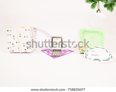 Christmas decoration with square gift boxes with silver watch with christmas balls for celebration best Christmas holidays background image for invitation