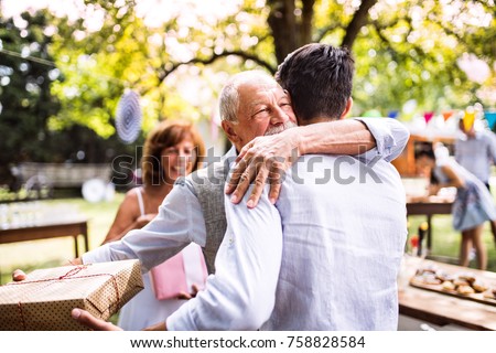 Family celebration or a garden party outside in the backyard. Royalty-Free Stock Photo #758828584