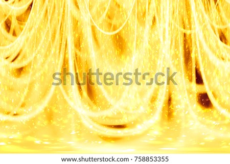 Abstract xmas Gold sparkles or glitter lights. Christmas festive gold background. Defocused lines bokeh or particles. Template for design