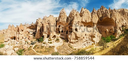 Cave town and rock formations in Zelve Valley, Cappadocia, Turkey Royalty-Free Stock Photo #758859544