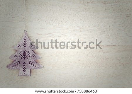 
Christmas and New Year's wooden background with Christmas tree decoration and text space 