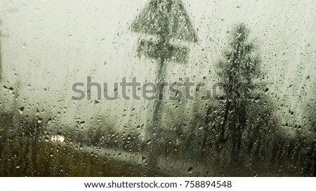 Water on glass on rain background
