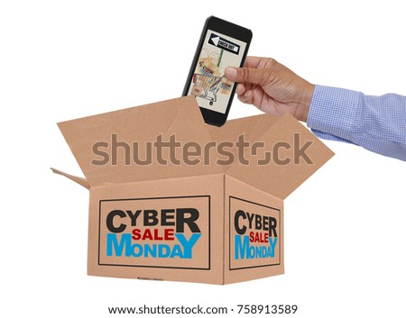 Hand placing cell phone with shopping cart full of Cyber Monday Sale Bags and box white background