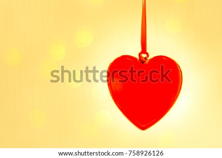 Valentines day greeting card, valentines day background, red glass heart, against a background of lights