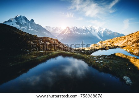 Great Mont Blanc glacier with Lac Blanc. Popular tourist attraction. Location Chamonix, Aiguilles Rouges, Graian Alps, France, Europe. Scenic image of hiking concept. Discover the beauty of earth.