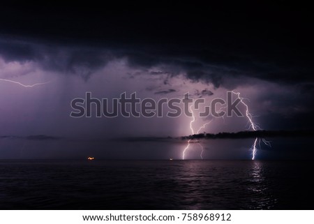Scenic image of dark ominous clouds. Thunderstorm with lightning. Climate change. Moody weather. Explore the beauty of earth. Picture of wild area. 