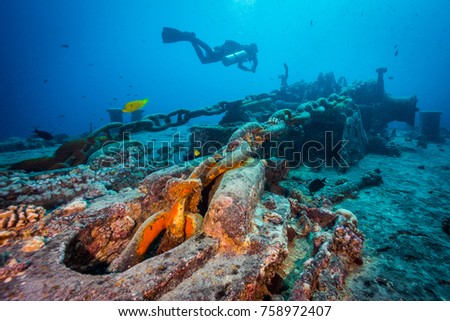 Diver over the anchor chain of Thistlegorm wreck. Northern Red Sea.  Royalty-Free Stock Photo #758972407