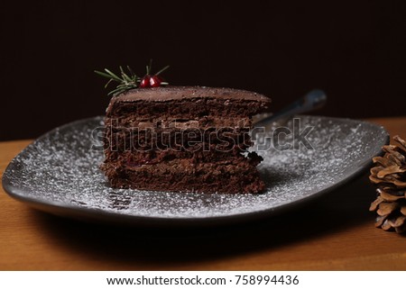 A plate with a slice of delicious chocolate pie with cherry Royalty-Free Stock Photo #758994436