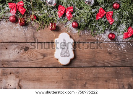 homemade gingerbread cookies on a rustic Christmas background