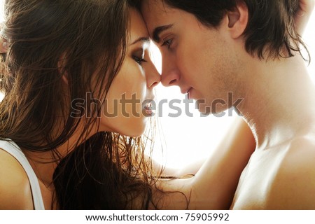 Portrait of young couple face to face Royalty-Free Stock Photo #75905992
