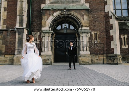 portrait of beautiful wedding couple  posing in city