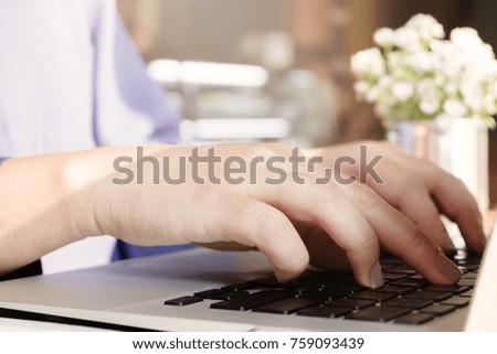 woman using laptop, searching web, browsing information, having work at cafe