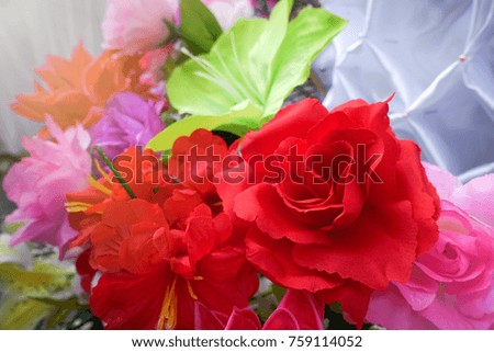 Fake flower and Floral background. rose flowers made of fabric. The fabric flowers bouquet. Colorful of decoration artificial flower