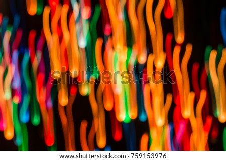 Abstract background with lights in blurred motion in the night or fireworks in new years eve