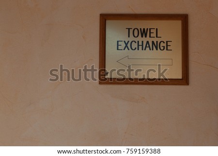 Isolated sign in spa of cruise ship showing directions to towel exchange