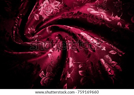 fabric, background texture. silk red fabric with a pattern of flowers. Add an exotic flash to your look with this Persian red abstract printed font SIlk Charmeuse.