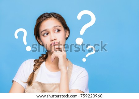 young housewife with question marks. Royalty-Free Stock Photo #759220960