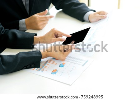 business businessman in meeting analyses chart graphy marketing plan in business project , white tablet screen with  clipping path
