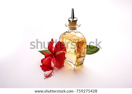Jaswand or Hibiscus oil over white background, selective focus