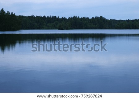 this is a photo of a lake one evening in summer