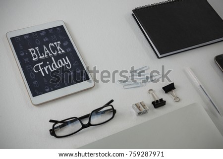 Various office accessories on white background against black friday