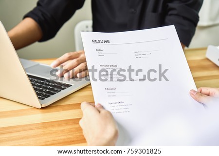 Young woman submit resume to employer to review job application. The concept presents the ability for the company to agree with the position of the job.
