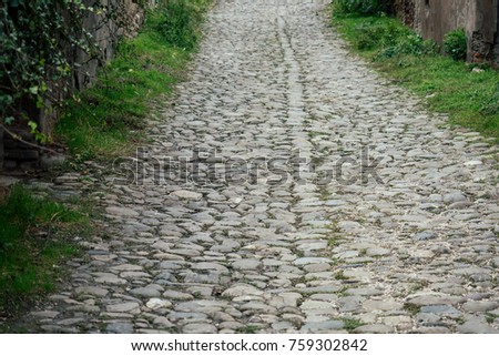 paved road with large stones