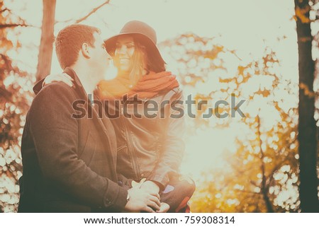 Beautiful gourgeous young couple in autumn park