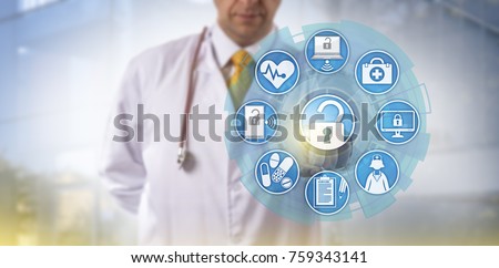 Unrecognizable doctor of medicine is accessing online healthcare data via a touch screen interface. Cyber security and IT concept for health information exchange or HIE within the medical sector. Royalty-Free Stock Photo #759343141