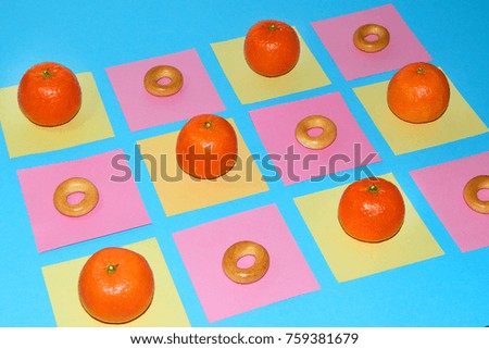 Candtes texture. Oranges and bagels on the table on note reminder color stickers