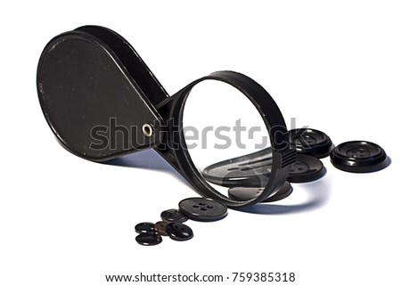 magnifying glass and button