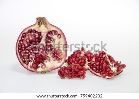 fresh and delicious pomegranate isolated on white background