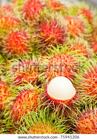 Tropical Fruit,white pulp rambutan among red rambutan.