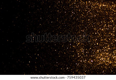 Gold glitter vintage lights texture background Christmas. defocused