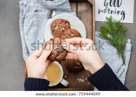 The perfect tasty breakfast!) Chocolate chip cookies with dark chocolate and sea pink Himalayan salt and cup of coffee
on a gray concrete background. Best Brown Butter Cookies. 