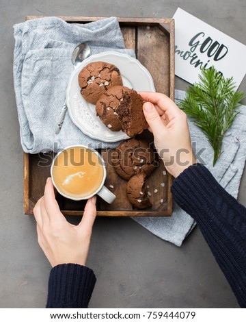 The perfect tasty breakfast!) Chocolate chip cookies with dark chocolate and sea pink Himalayan salt and cup of coffee
on a gray concrete background. Best Brown Butter Cookies. 