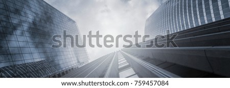 Modern office buildings skyscrapers in a business district, including copy space, banner size Royalty-Free Stock Photo #759457084