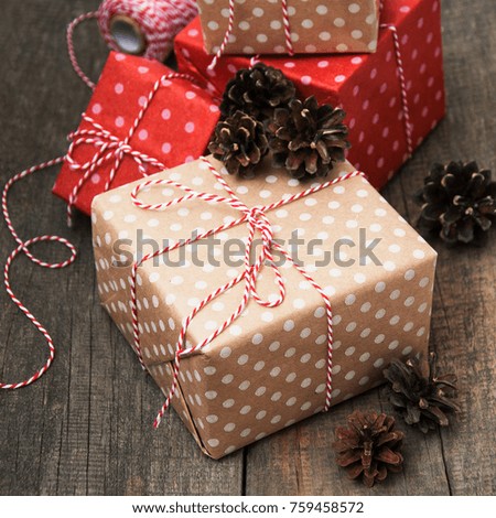 Christmas gift boxes and decorations on wooden background