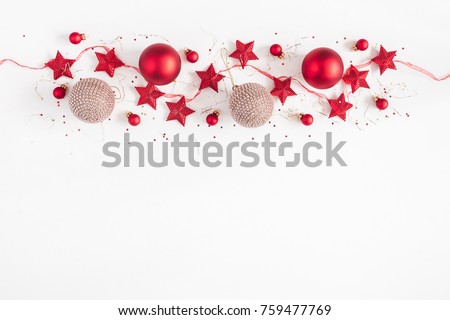 Christmas border. Christmas balls, garland, red and golden decorations on white background. Flat lay, top view, copy space