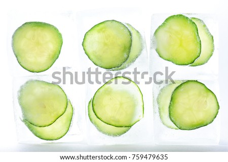 Frozen cucumber slices in the ice cubes