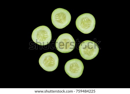Sliced cucumber isolated on black background