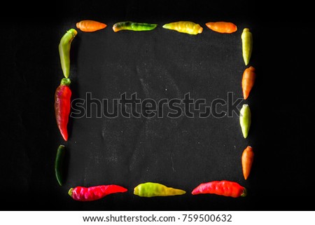 chili peppers with black background