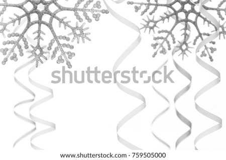 Christmas background. Carnival festive curling paper decorations hanging. Snowflakes and streamer on carnival, isolated on white background.
