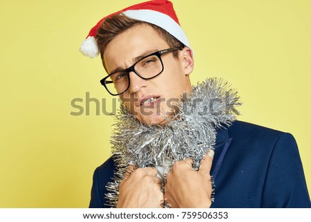  a man with a tinsel, a Christmas celebration                              