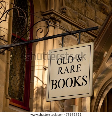 Sign hanging outside an old building, reads "Old & Rare Books"; Melbourne, Australia.