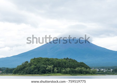 View of the Fuji mountain from the shore of the pond. Japan