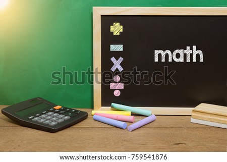 Math concept with calculator on blackboard.  concept education