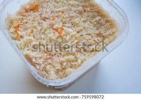 Preparation of Sauerkraut in a plastic container