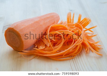 Sliced carrot on a wooden table