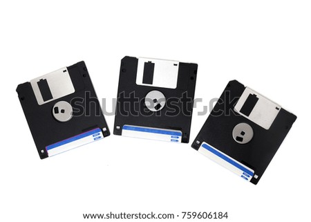 three computer floppy disks on a composition isolated on a white background.
